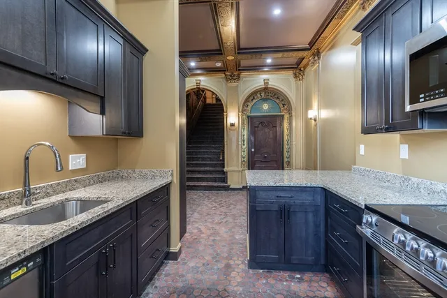 a kitchen with refrigerator and window