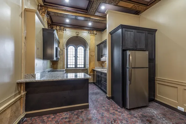 a front view of a residential apartment building with a yard