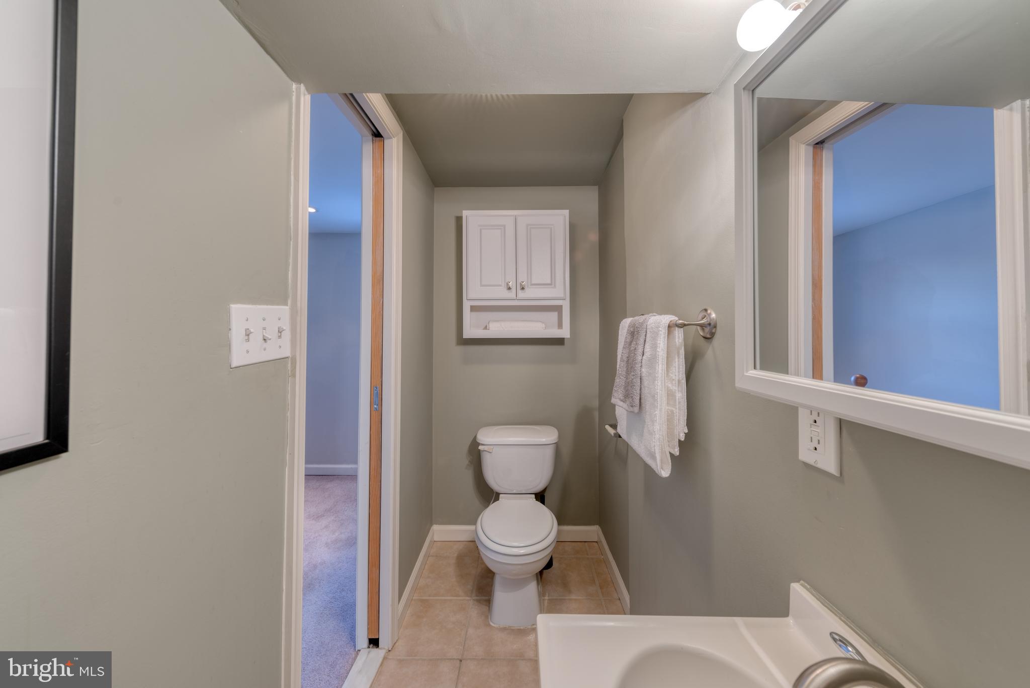 1104 Riverside Avenue Baltimore, MD 21230 - Photo 22 of 26 a bathroom with a toilet and a shower