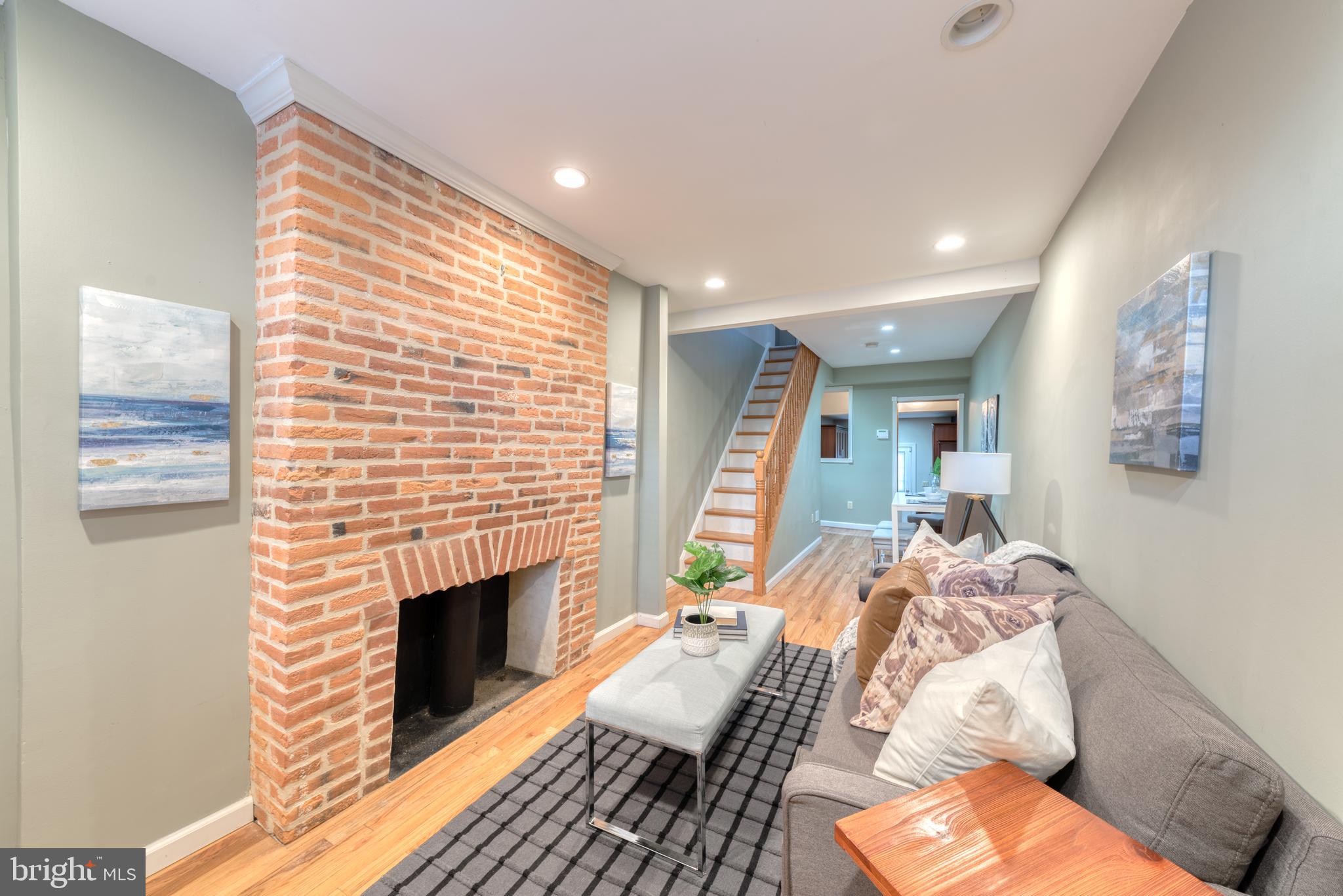 1104 Riverside Avenue Baltimore, MD 21230 - Photo 4 of 26 a bed room with a bed and a fireplace