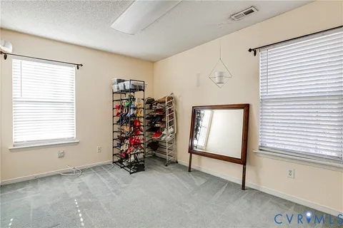 a view of a livingroom with toys and a window