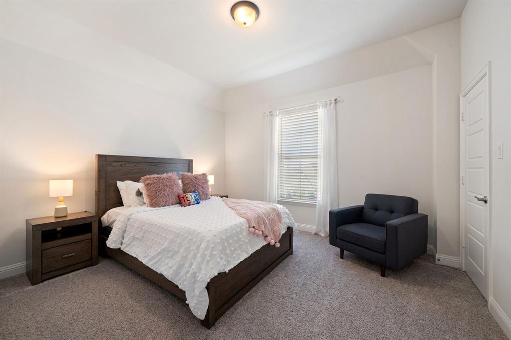 11705 Little Elm Creek Road Flower Mound, TX 76226 - Photo 24 of 39 a bedroom with a bed and a couch