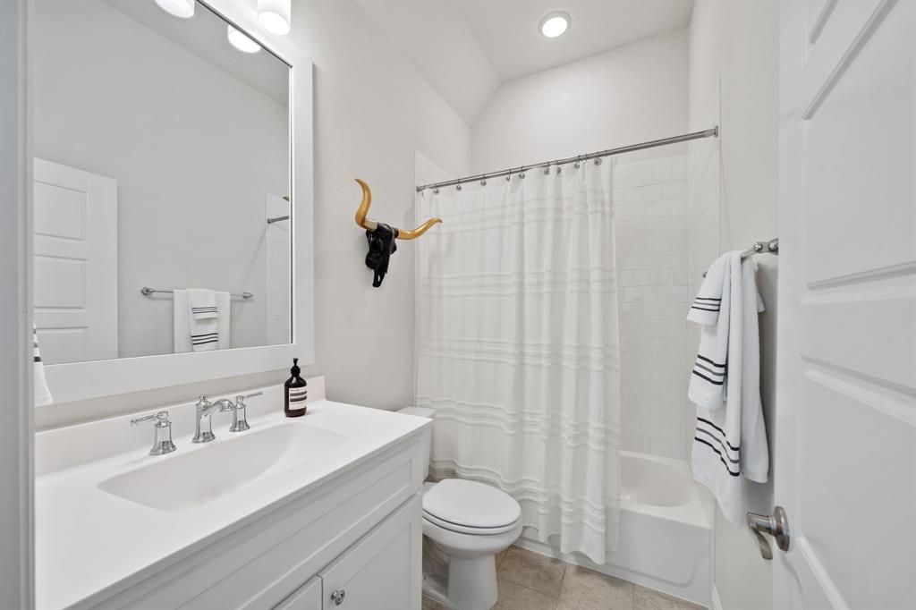 11705 Little Elm Creek Road Flower Mound, TX 76226 - Photo 28 of 39 a bathroom with a sink toilet and shower