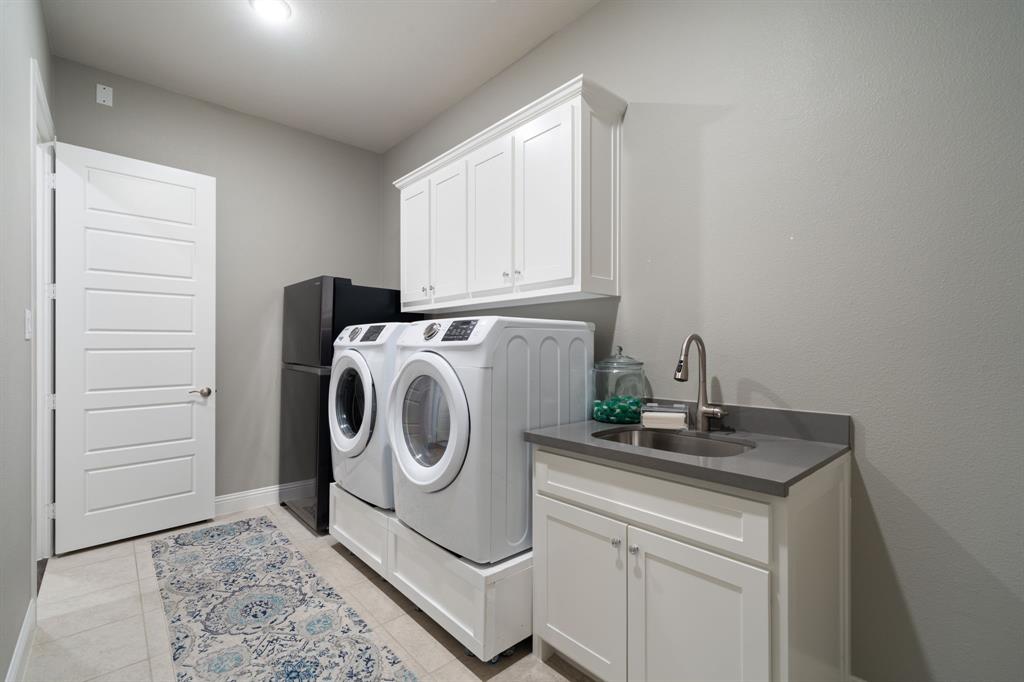 11705 Little Elm Creek Road Flower Mound, TX 76226 - Photo 29 of 39 a utility room with sink dryer and washer