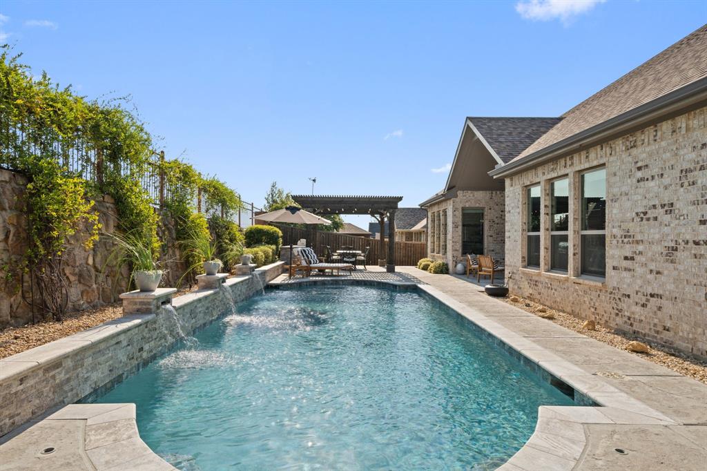 11705 Little Elm Creek Road Flower Mound, TX 76226 - Photo 33 of 39 a view of a patio with swimming pool table and chairs