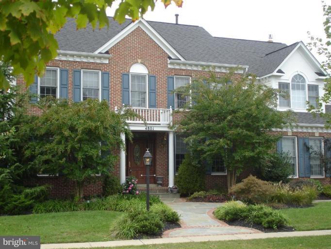 4801 Broom Drive Olney, MD 20832 - Photo 1 of 19 a front view of a house with a yard and potted plants
