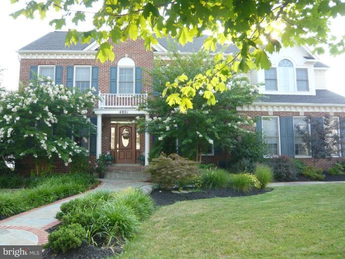 4801 Broom Drive Olney, MD 20832 - Photo 2 of 19 a front view of a house with garden
