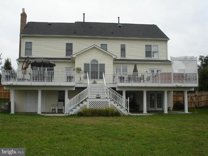 4801 Broom Drive Olney, MD 20832 - Photo 15 of 19 a front view of a house with a garden
