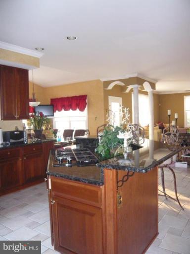 4801 Broom Drive Olney, MD 20832 - Photo 4 of 19 a kitchen with stainless steel appliances granite countertop a stove a sink and a refrigerator