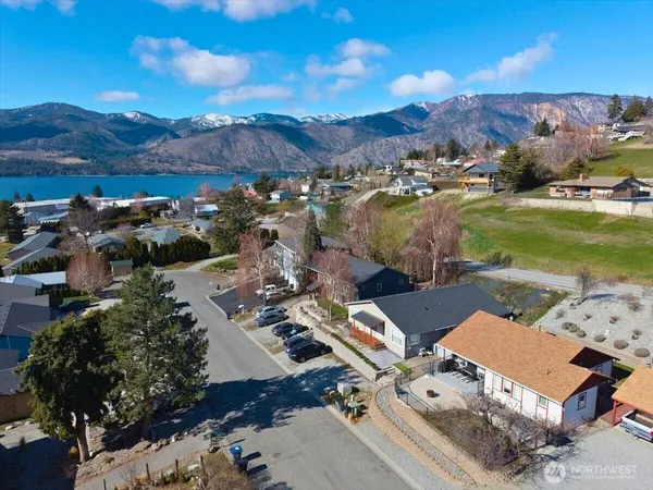an aerial view of a house with mountain view