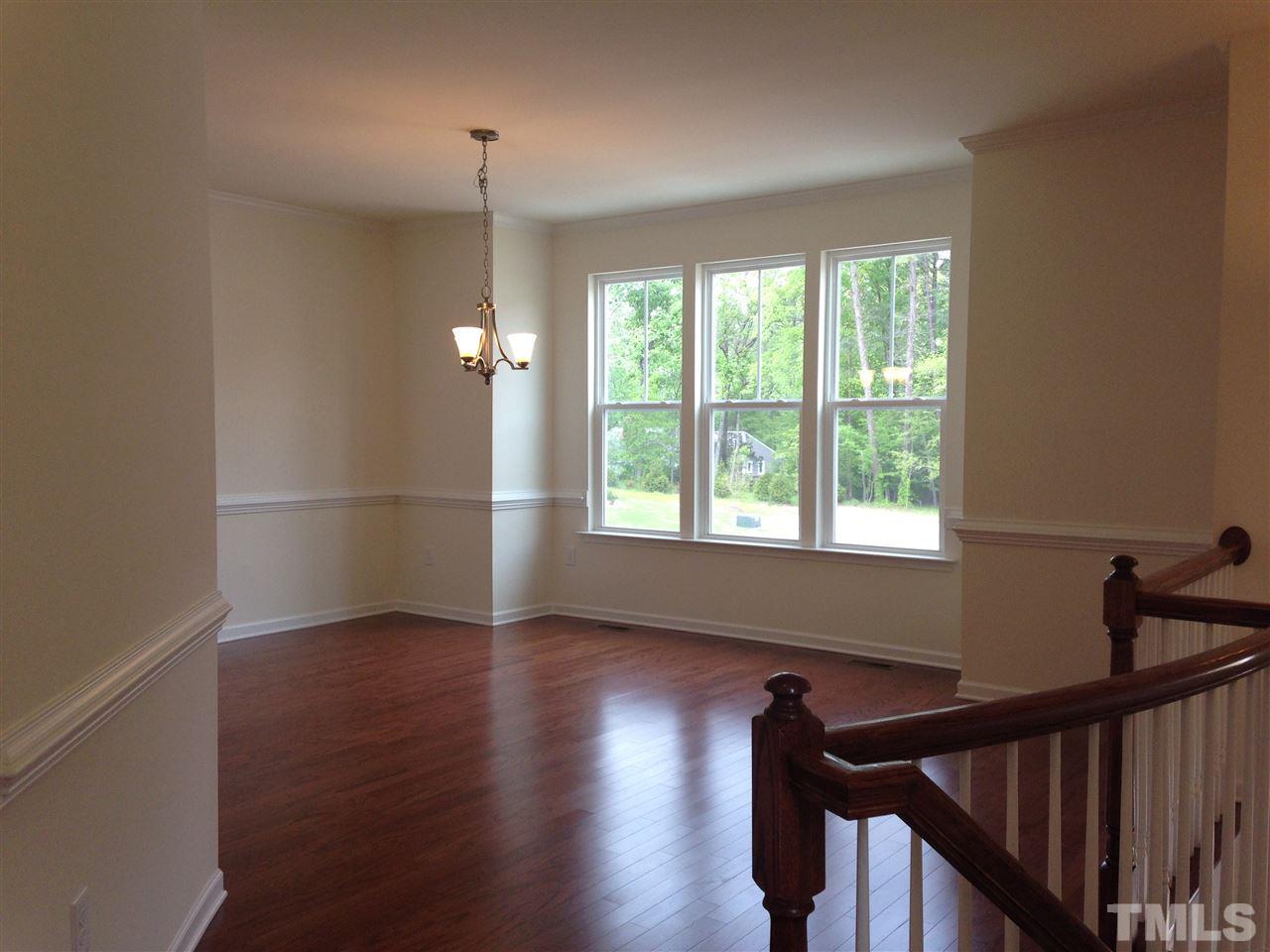 633 Edgewater Ridge Court Apex, NC 27523 - Photo 8 of 21 Great space for entertaining or as a morning room with table and sitting area.