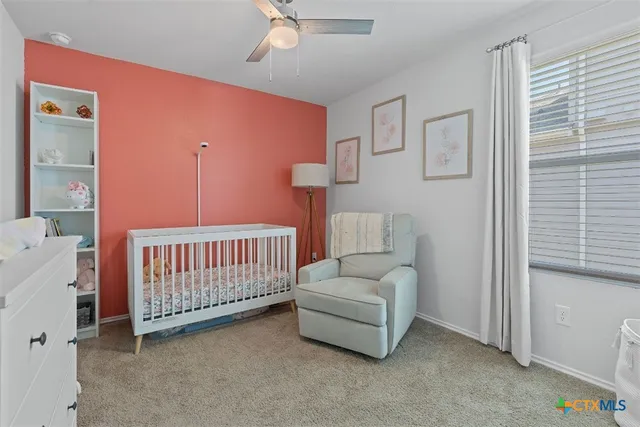 a bedroom with furniture and a window