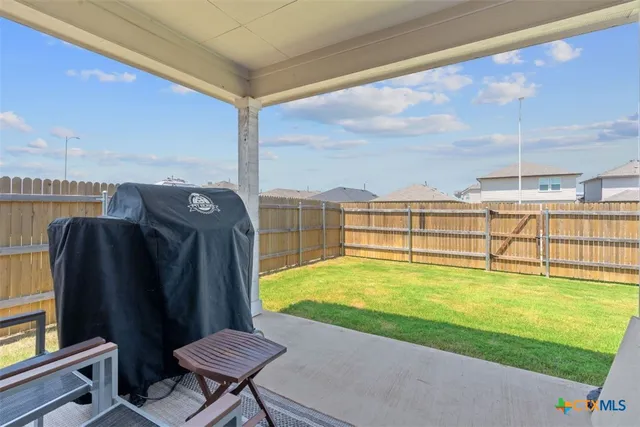 a view of a swimming pool with an outdoor seating