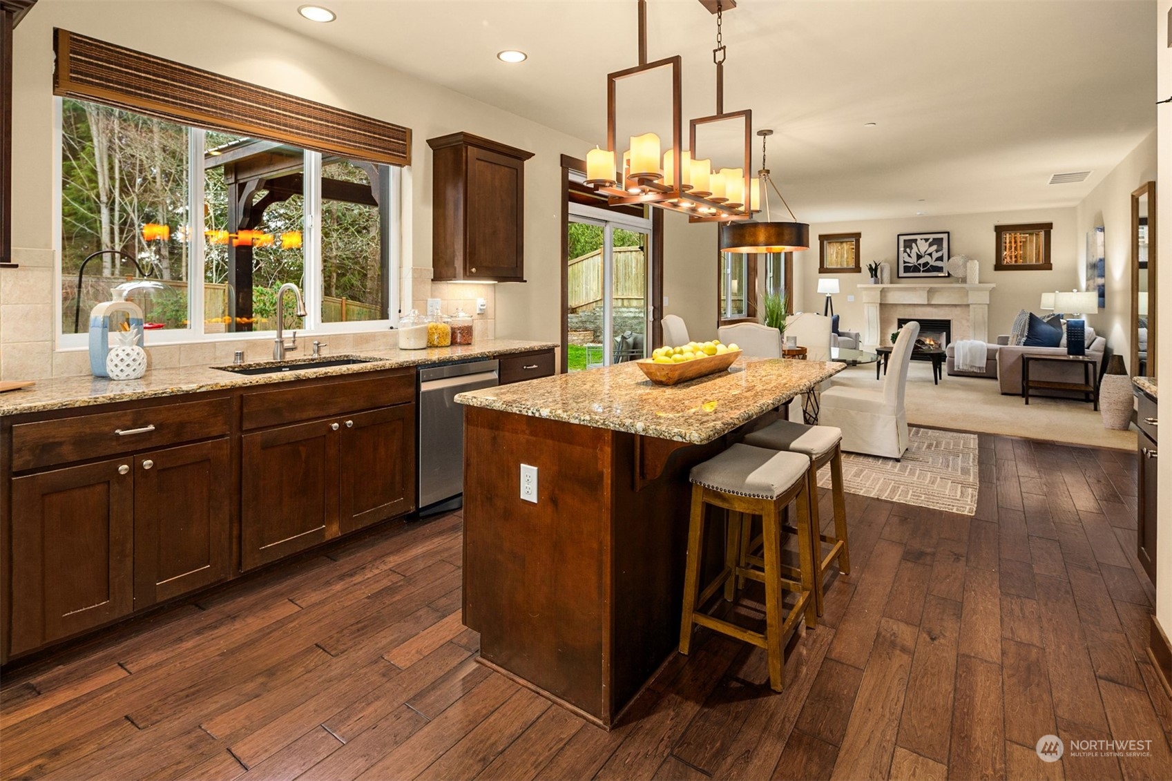 21710 31st Drive Southeast Bothell, WA 98021 - Photo 11 of 35 a kitchen with stainless steel appliances granite countertop wooden floors and sink