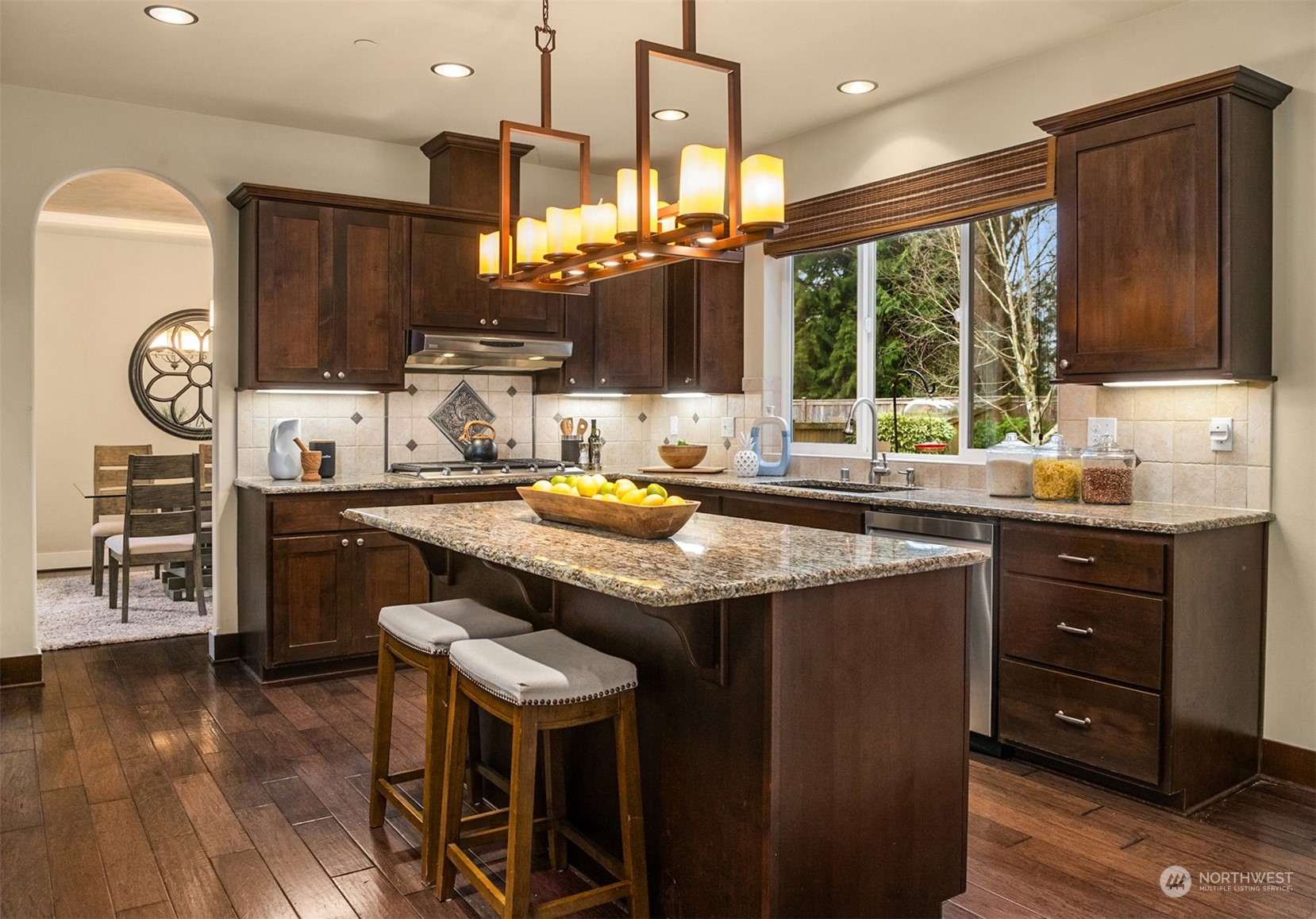 21710 31st Drive Southeast Bothell, WA 98021 - Photo 13 of 35 a kitchen with a sink a stove and chairs