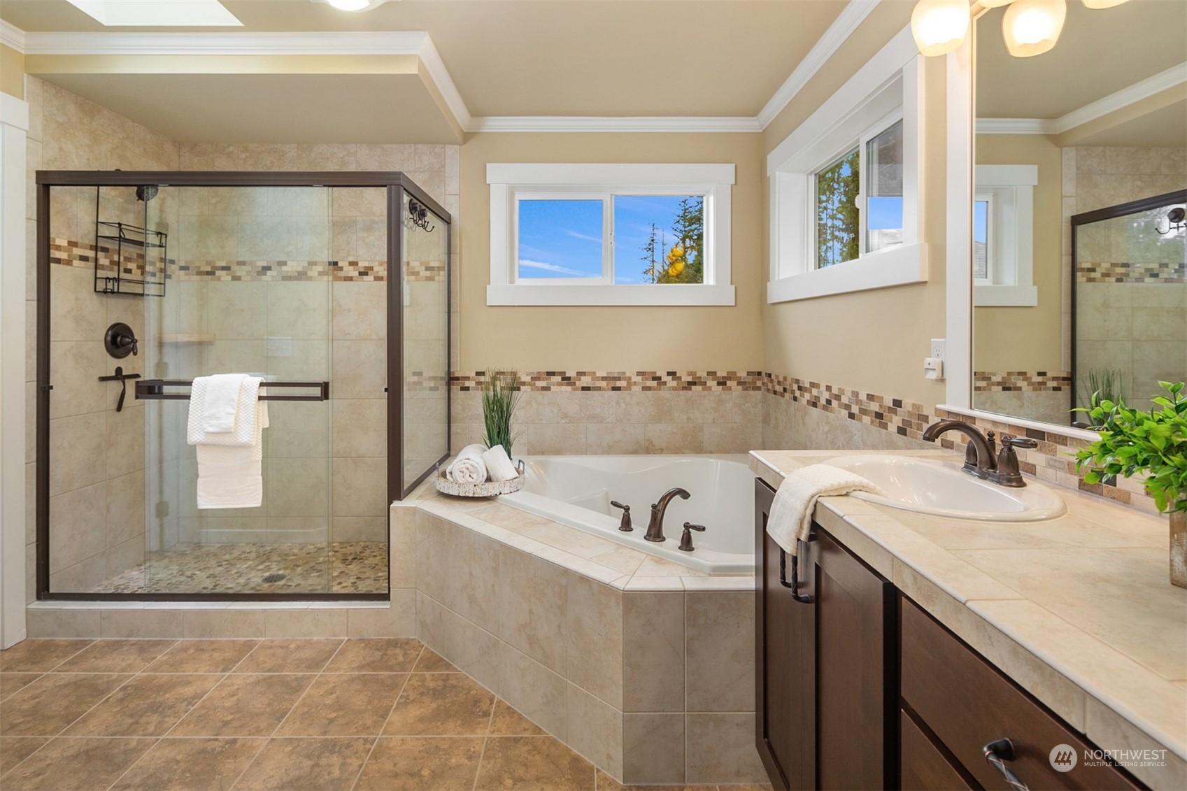 21710 31st Drive Southeast Bothell, WA 98021 - Photo 22 of 35 a bathroom with a tub a sink and mirror