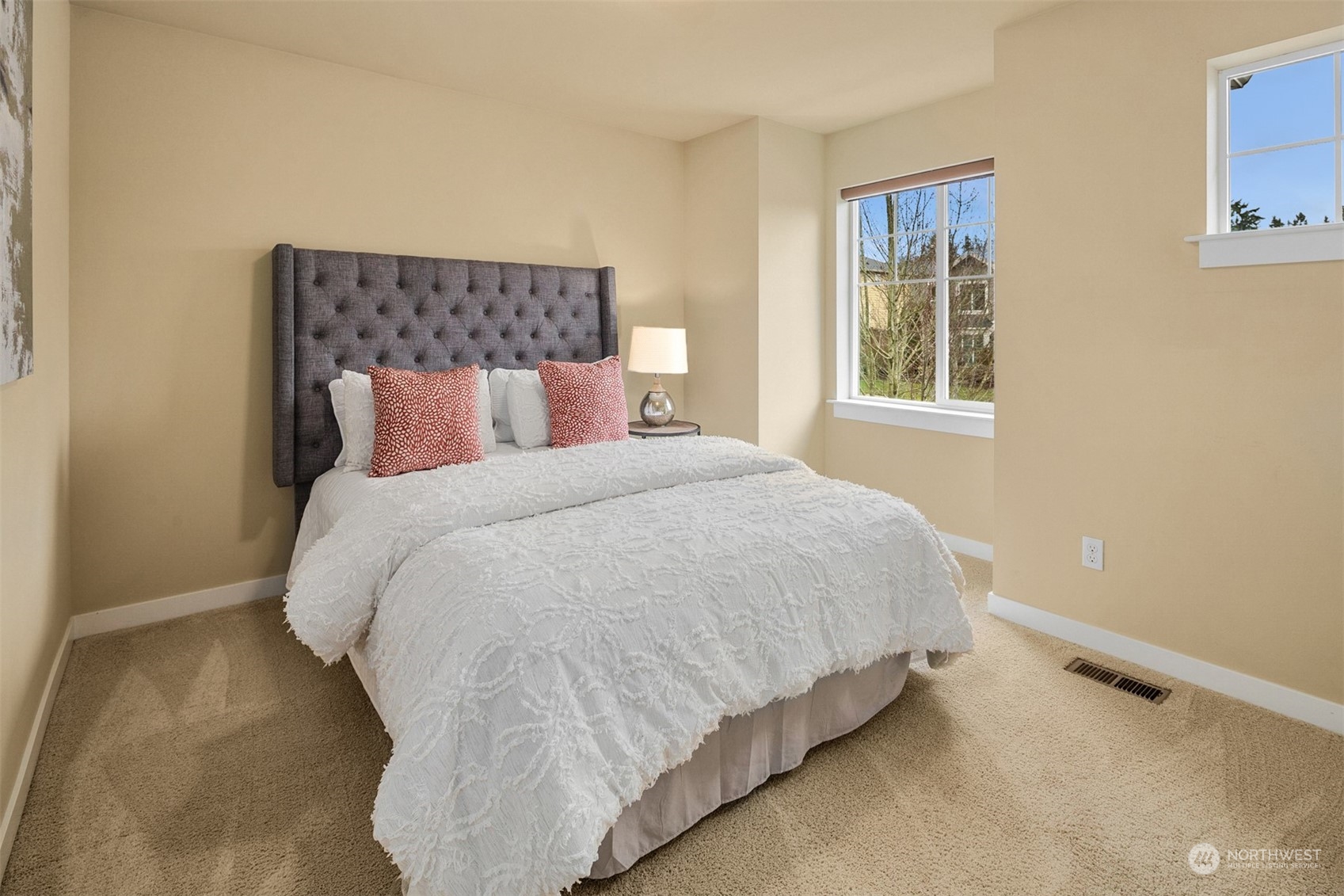 21710 31st Drive Southeast Bothell, WA 98021 - Photo 26 of 35 a large bed sitting in a bedroom next to a window