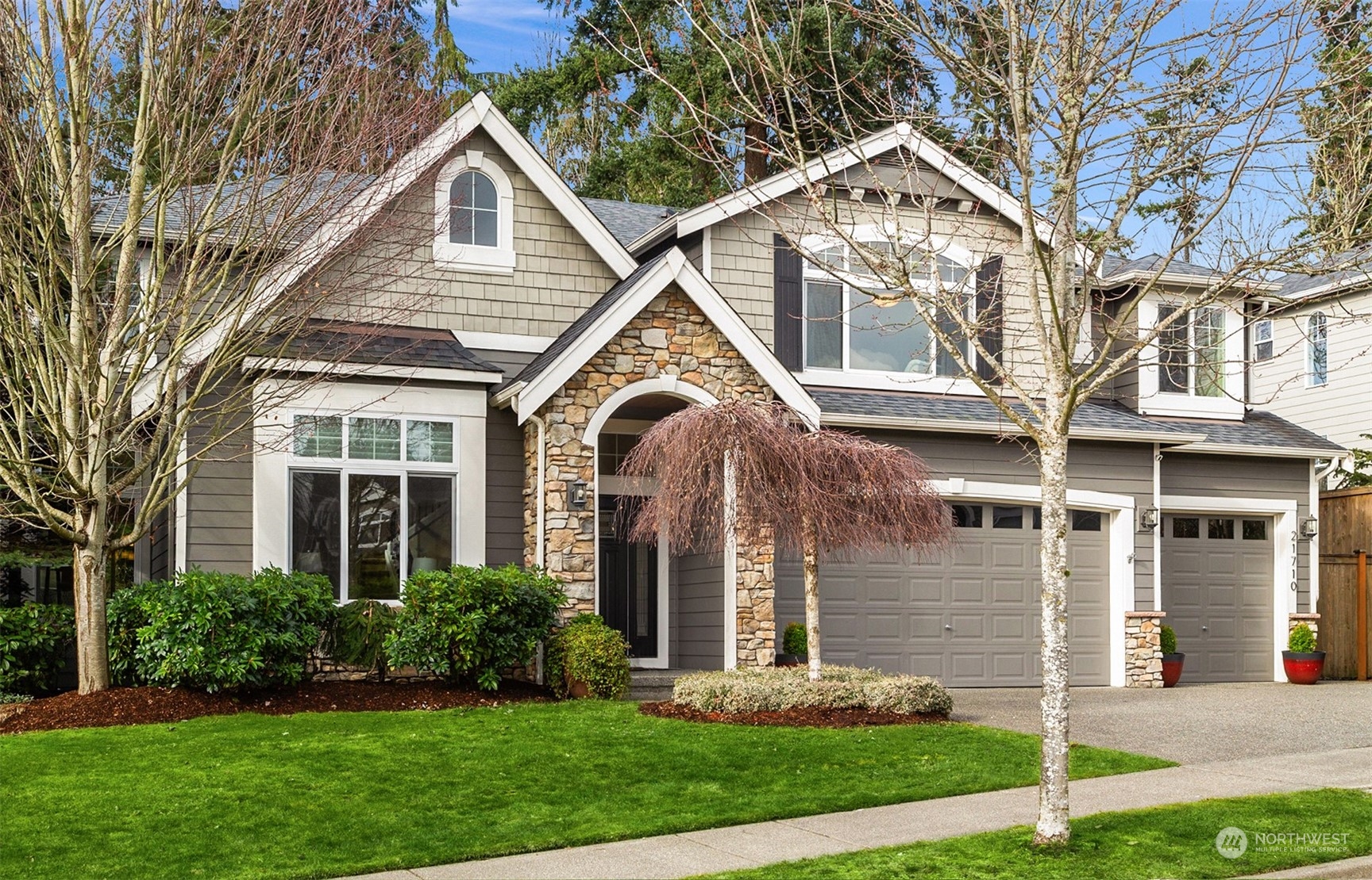 21710 31st Drive Southeast Bothell, WA 98021 - Photo 35 of 35 a front view of a house with a yard and plants