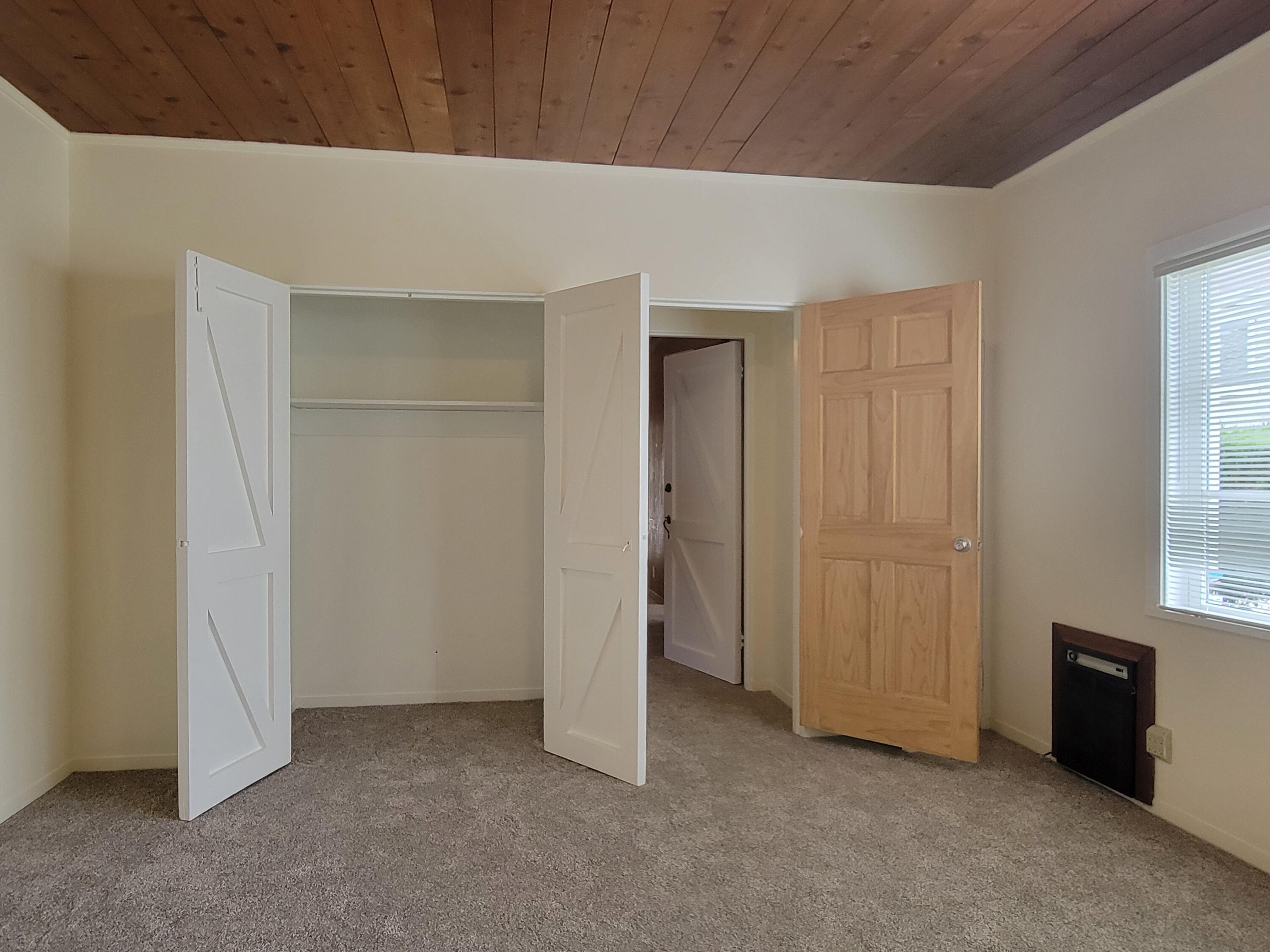 219 Ladera Street, Unit 1 Santa Barbara, CA 93101 - Photo 2 of 9 an empty room with windows
