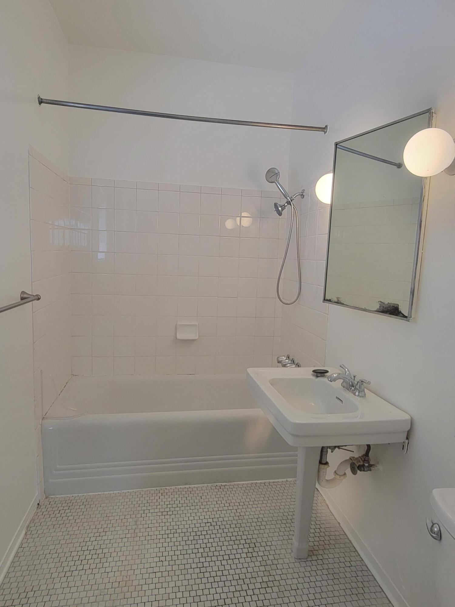 219 Ladera Street, Unit 1 Santa Barbara, CA 93101 - Photo 5 of 9 a bathroom with a sink a toilet and shower