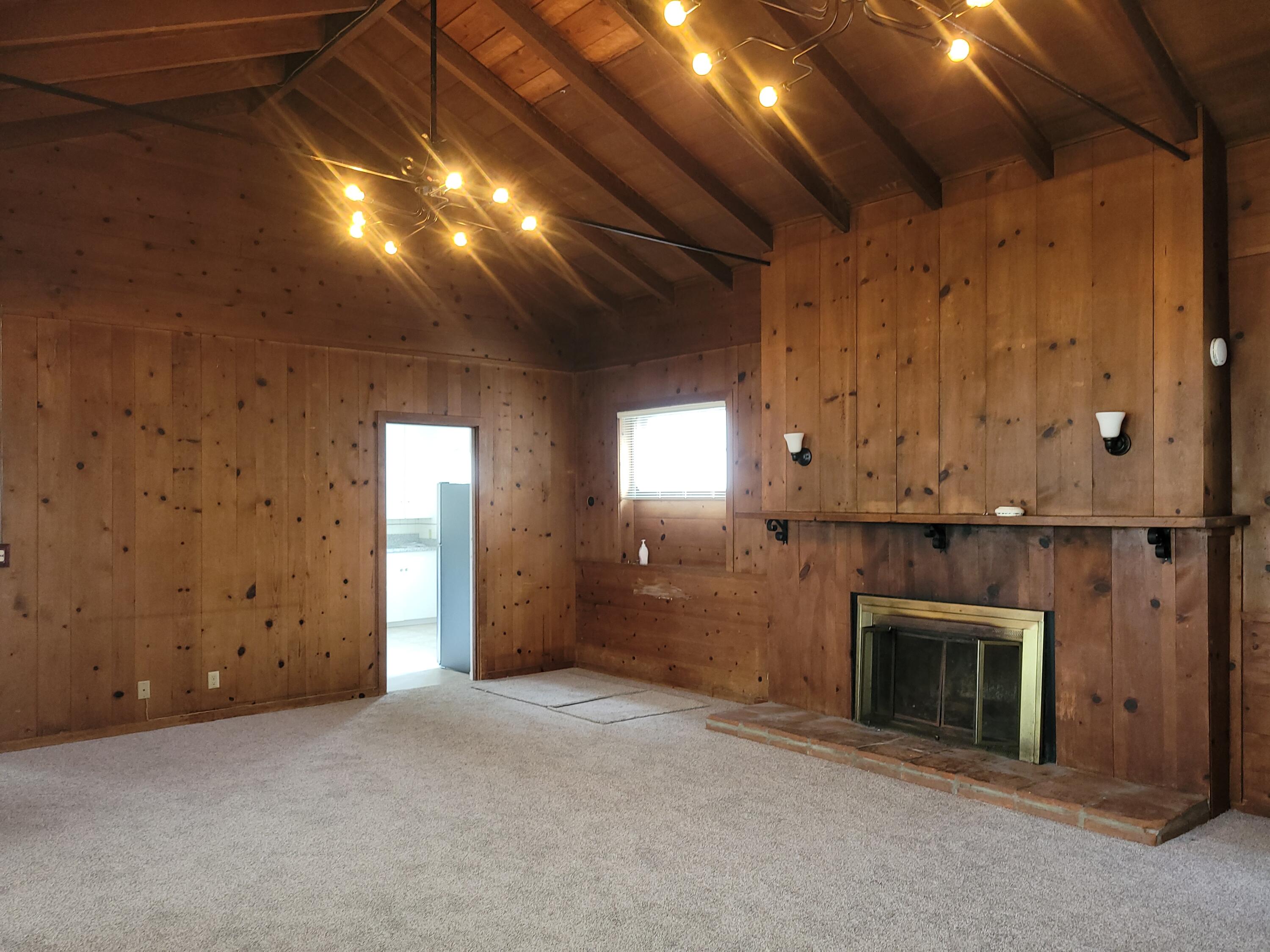 219 Ladera Street, Unit 1 Santa Barbara, CA 93101 - Photo 7 of 9 a view of an empty room with a fireplace