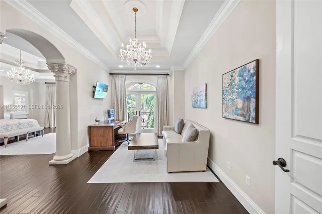 a bedroom with a bed a dresser and chair