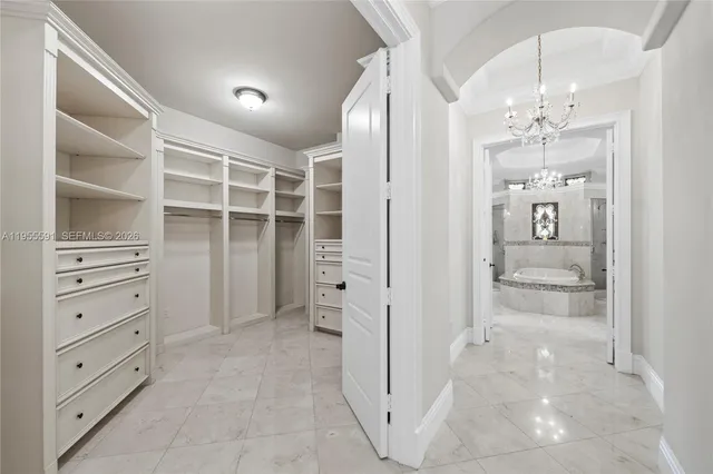 a bedroom with a bed and a view of bedroom