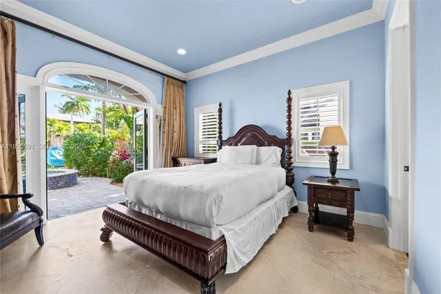 a bathroom with a sink a toilet a mirror and shower