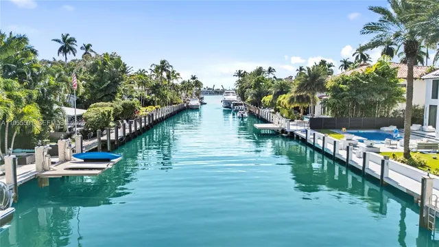 a view of a lake with houses in the back
