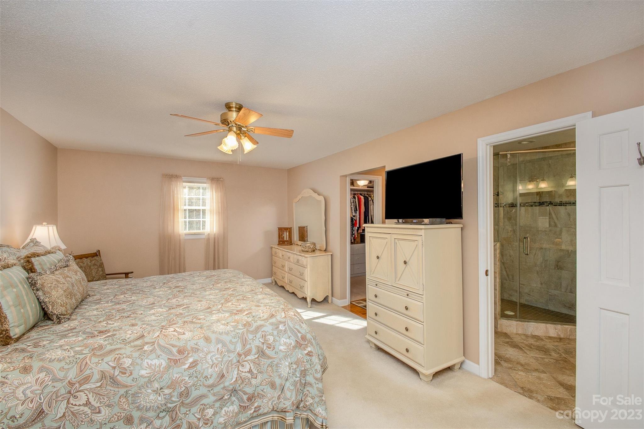 8229 Fairfield Forest Road Denver, NC 28037 - Photo 23 of 41 a bedroom with furniture white cabinet and a flat screen tv