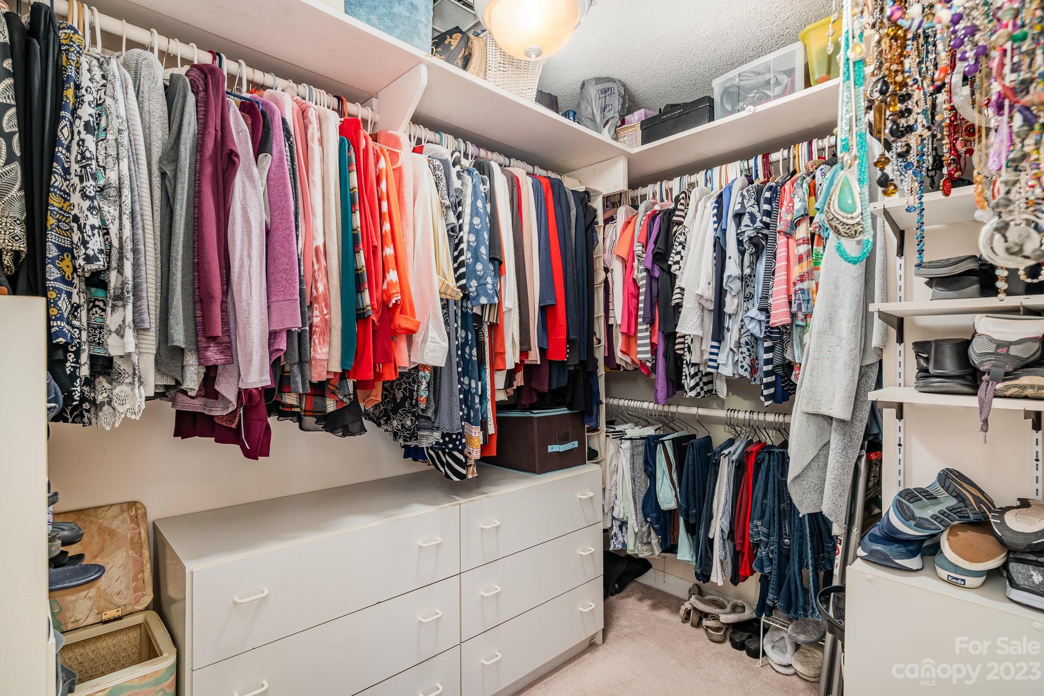 8229 Fairfield Forest Road Denver, NC 28037 - Photo 27 of 41 a view of walk in closet with clothes