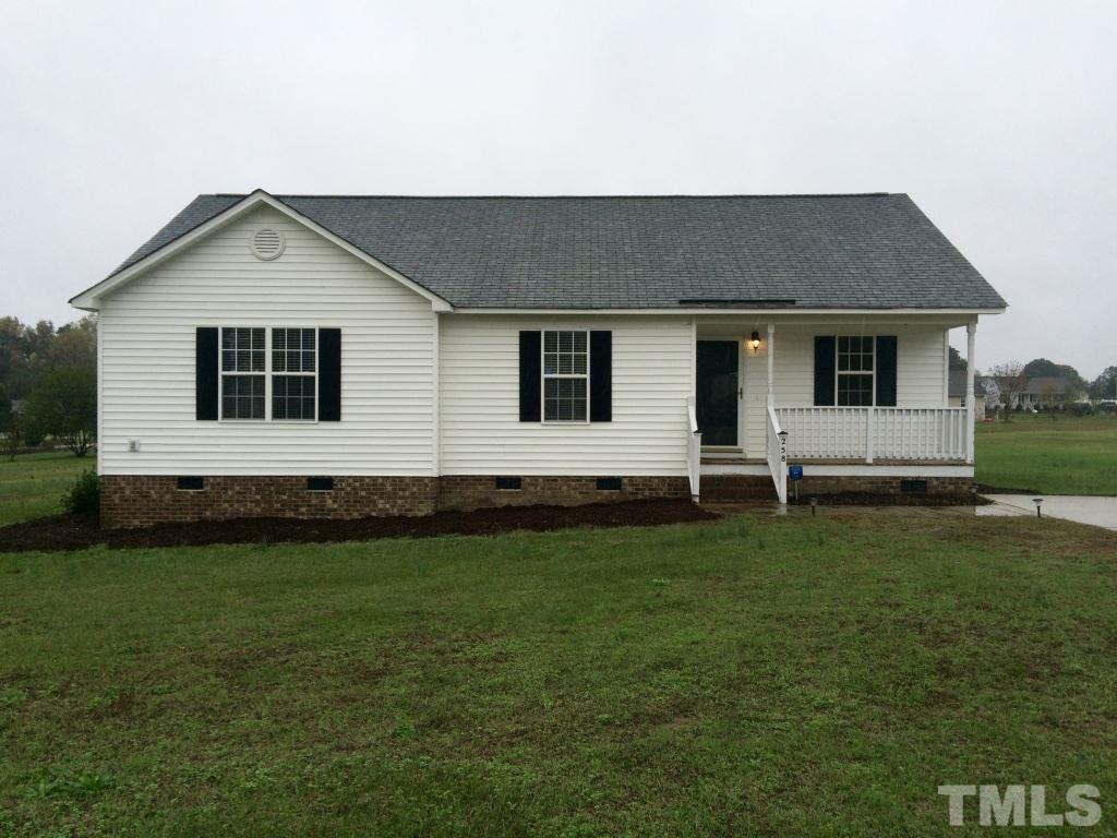 258 Wagner Road Willow Spring, NC 27592 - Photo 1 of 22 a house that has a backyard