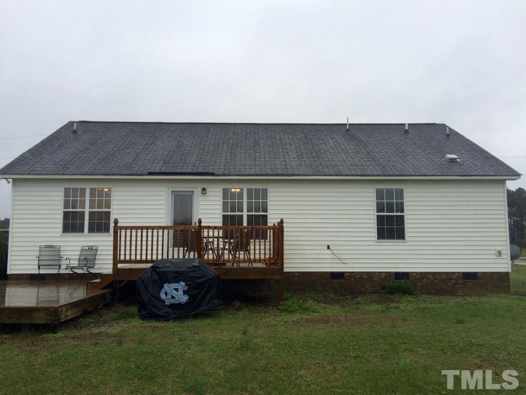 258 Wagner Road Willow Spring, NC 27592 - Photo 18 of 22 a front view of a house with a garden