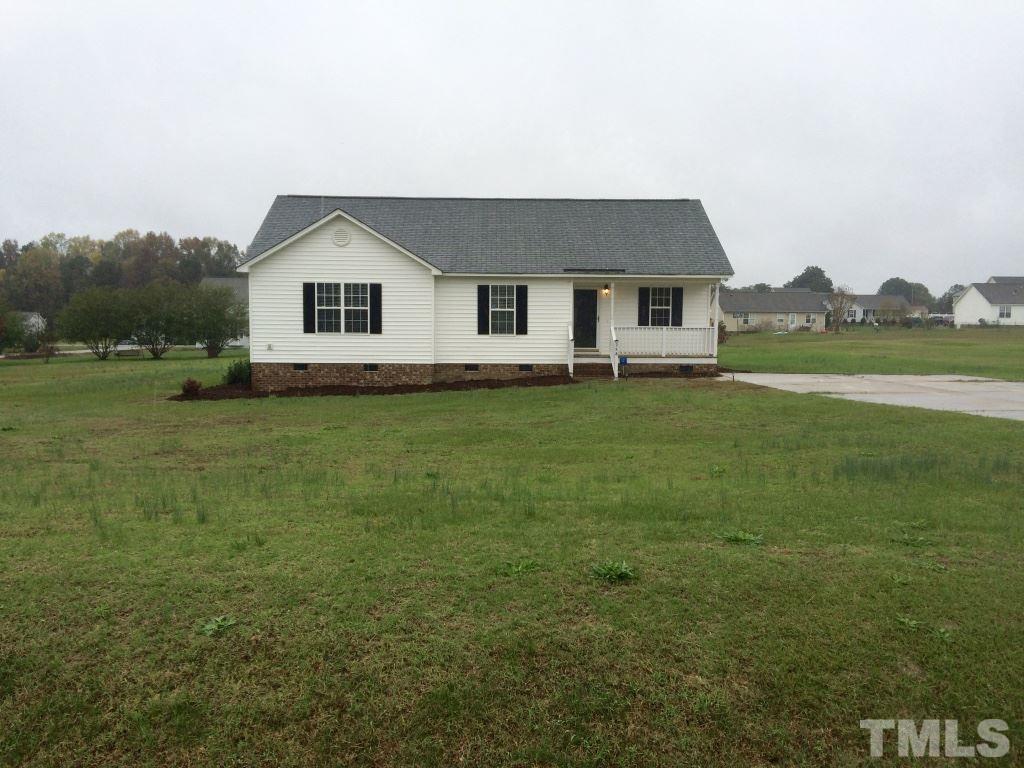 258 Wagner Road Willow Spring, NC 27592 - Photo 22 of 22 a house view with a garden space