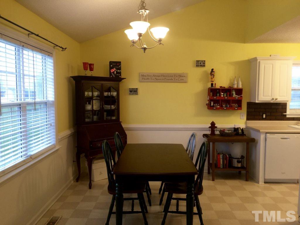 258 Wagner Road Willow Spring, NC 27592 - Photo 6 of 22 a view of a dining room with furniture and window