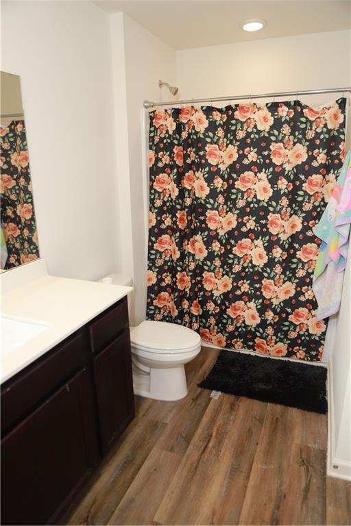 11900 Fuller Street Hampton, GA 30228 - Photo 14 of 17 a bathroom with a toilet sink and mirror