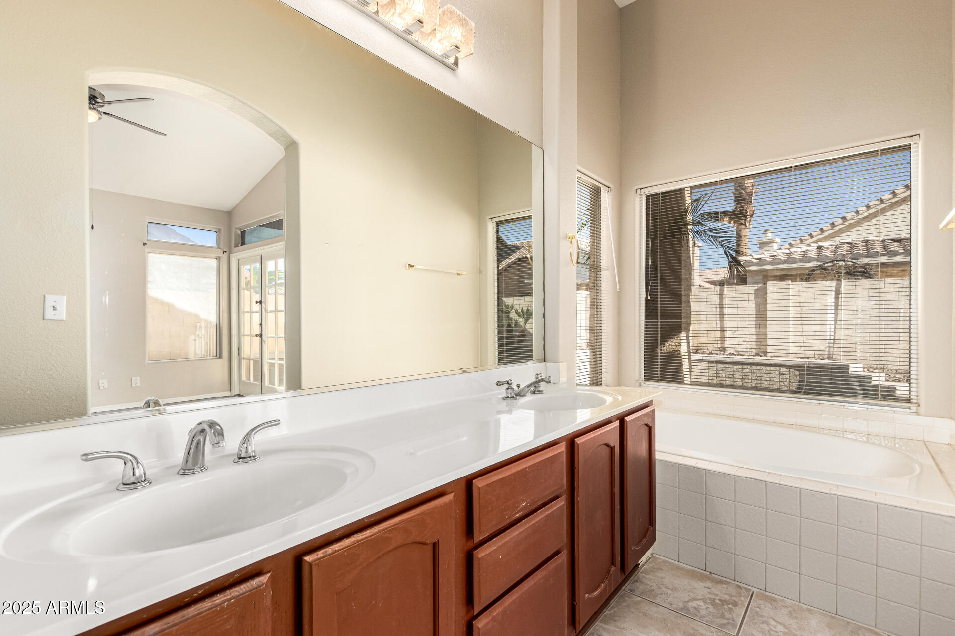 16617 South 14th Street Phoenix, AZ 85048 - Photo 16 of 26 a bathroom with a tub sink and mirror