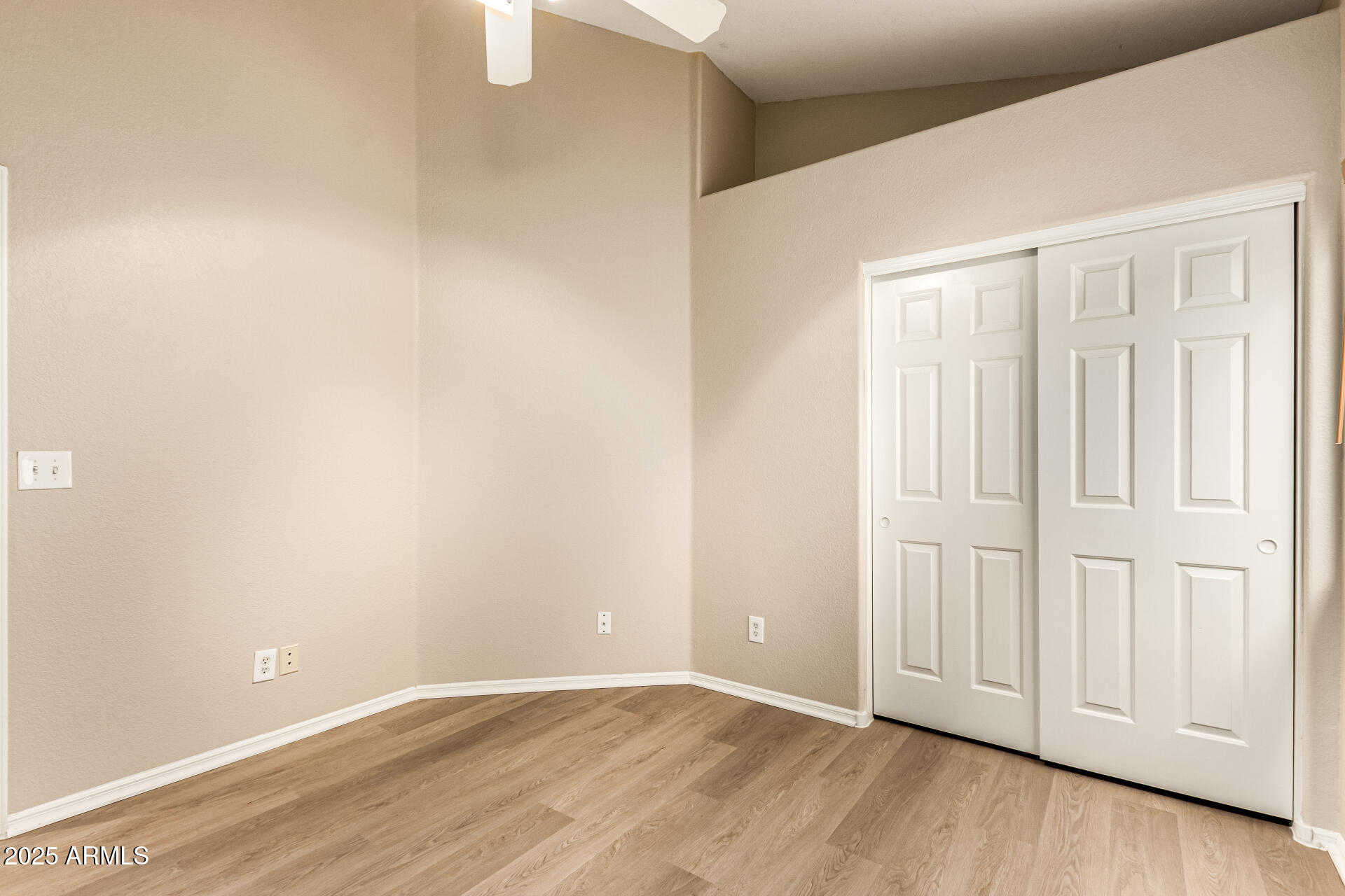 16617 South 14th Street Phoenix, AZ 85048 - Photo 20 of 26 a view of an empty room with wooden floor