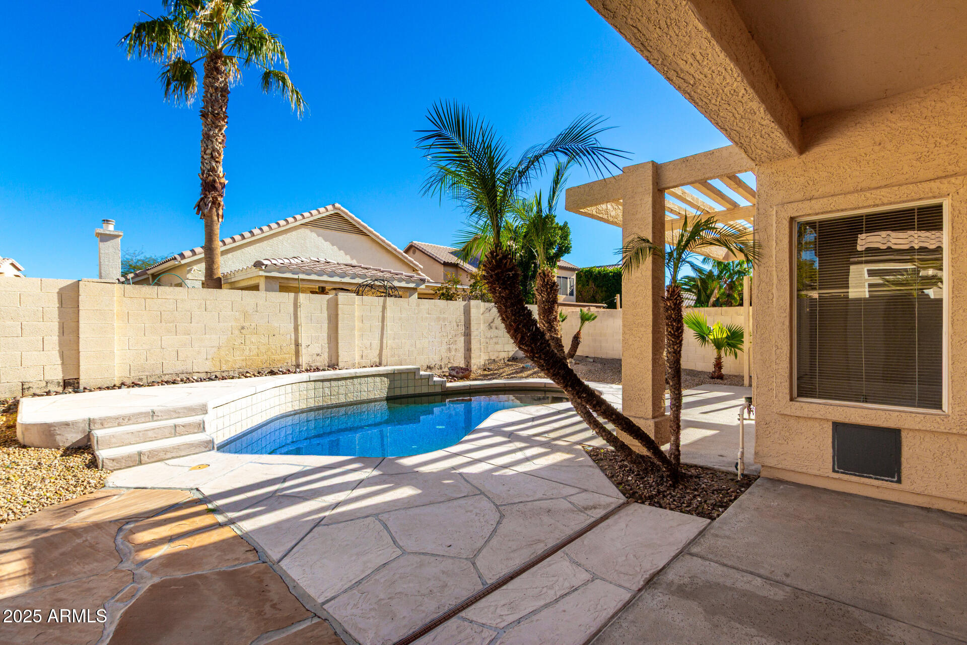 16617 South 14th Street Phoenix, AZ 85048 - Photo 23 of 26 a view of a house with backyard and swimming pool