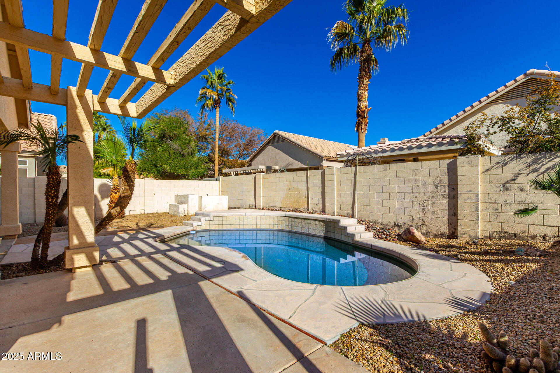 16617 South 14th Street Phoenix, AZ 85048 - Photo 26 of 26 a view of a house with swimming pool and sitting area