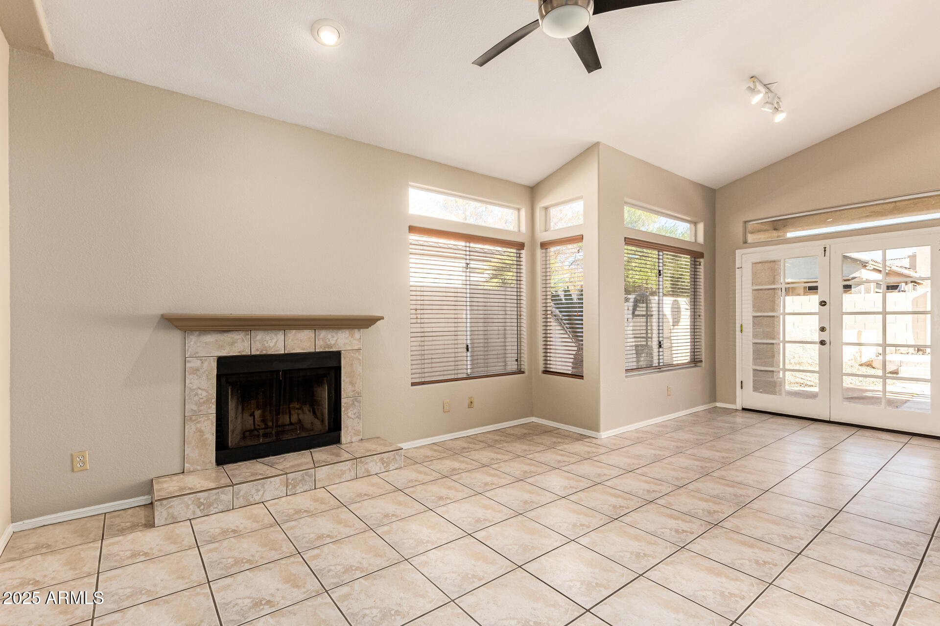 16617 South 14th Street Phoenix, AZ 85048 - Photo 7 of 26 a view of an empty room with window and fire place