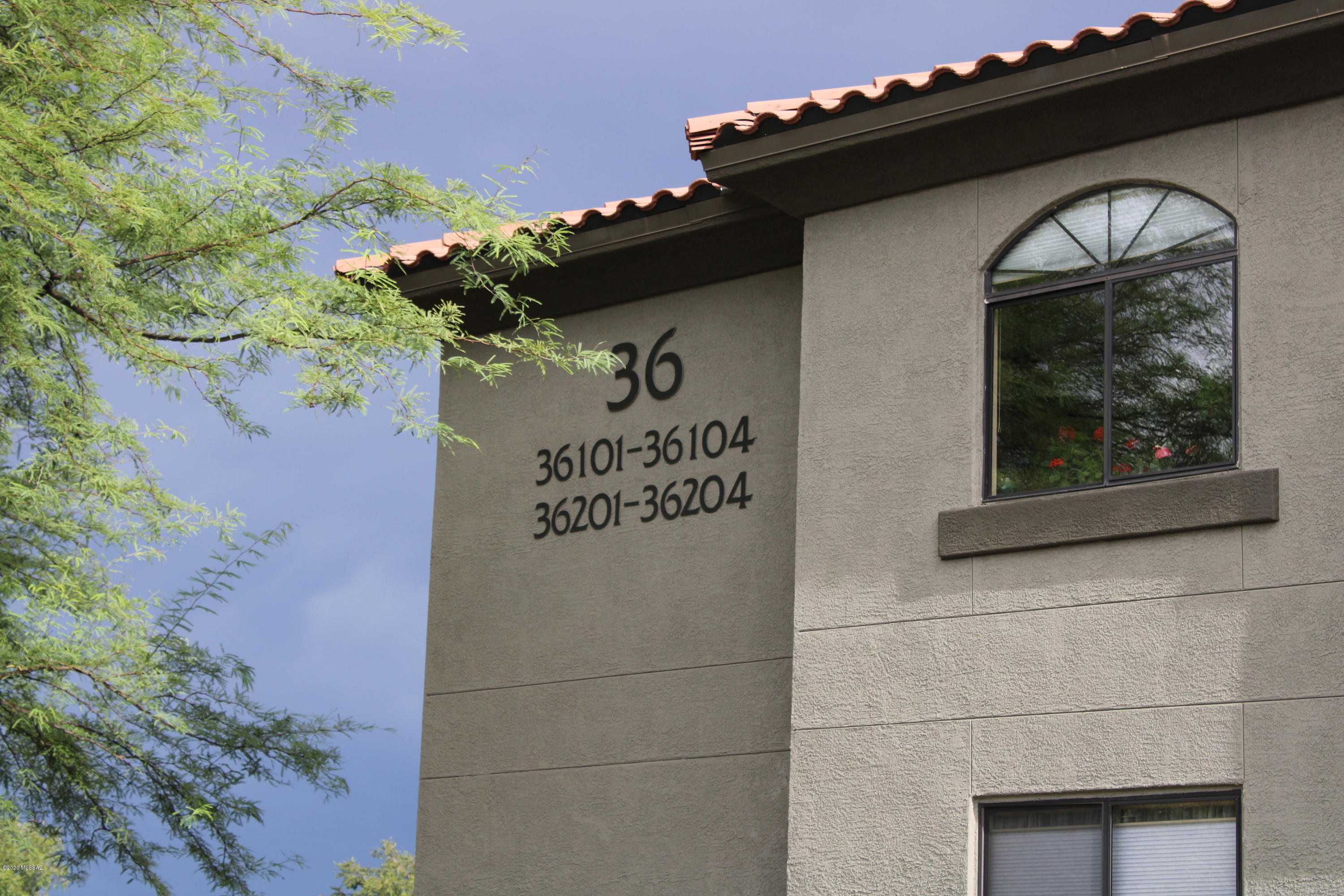 5751 North Kolb Road, Unit 36203 Tucson, AZ 85750 - Photo 24 of 25 a front view of a house with a garage
