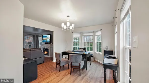 a view of a dining room with furniture and window