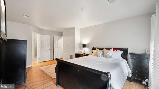 a bedroom with a bed and a walk in closet