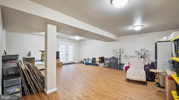a room with lots of wooden furniture and a wooden floor