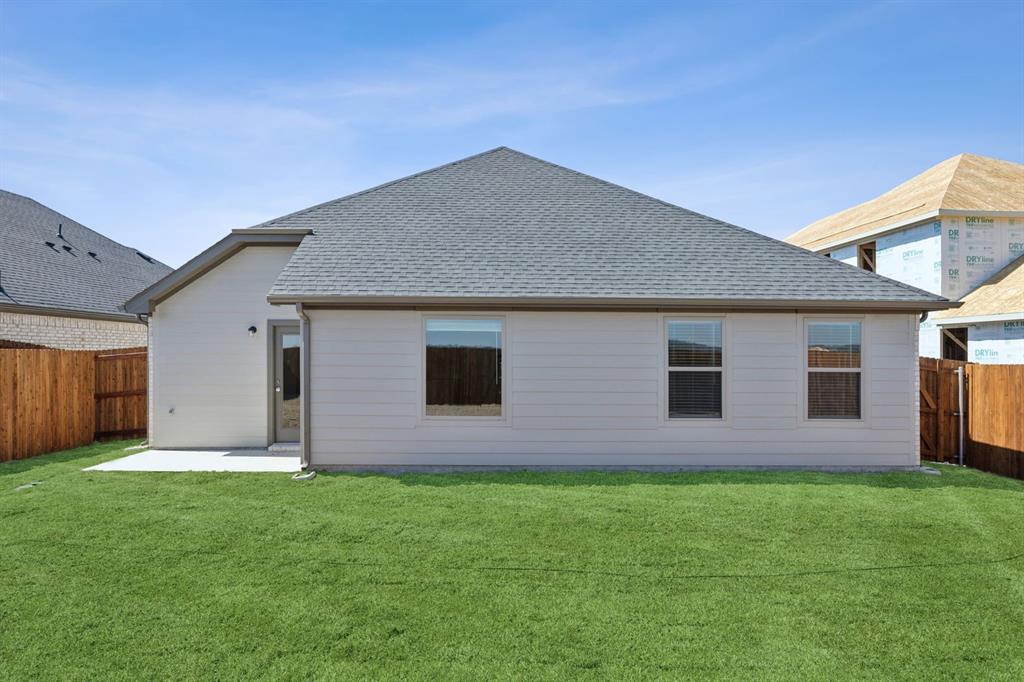 7620 Kingfisher Road Aubrey, TX 76227 - Photo 28 of 32 a front view of house with yard and green space
