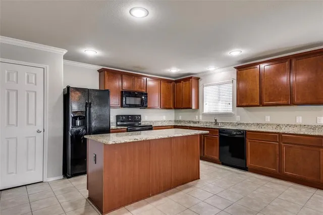 a kitchen with a sink stove and refrigerator