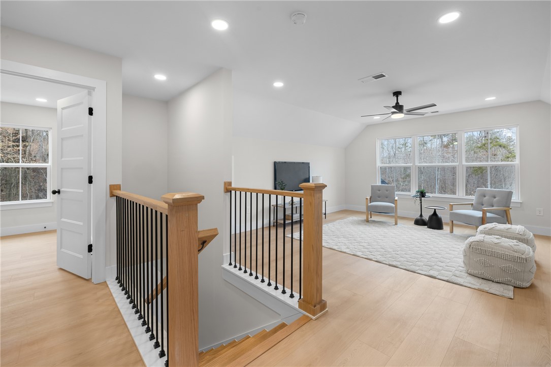 502 Point Road Westminster, SC 29693 - Photo 21 of 45 Bright and inviting loft area features a stunning staircase and expansive windows.