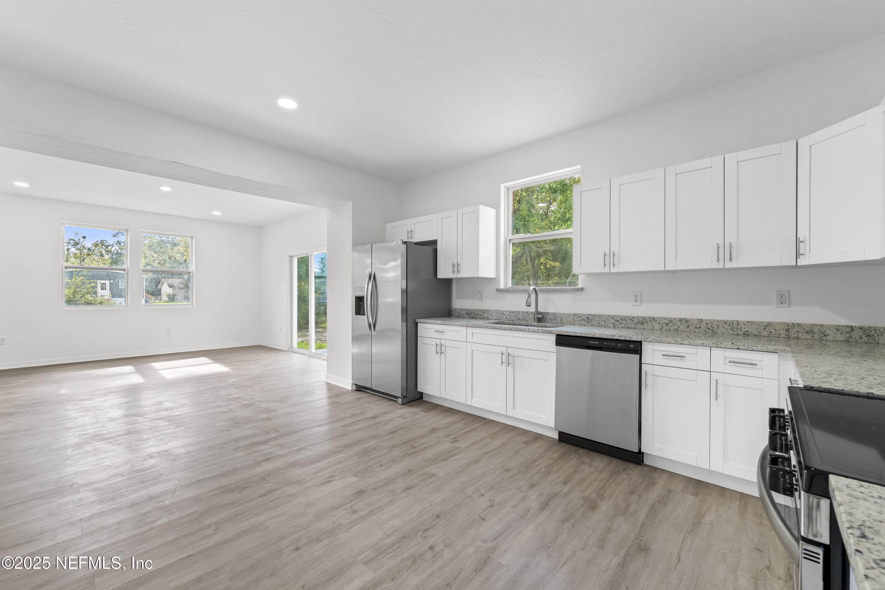 12476 Gate Road Jacksonville, FL 32226 - Photo 14 of 29 a kitchen with granite countertop a window and white appliances