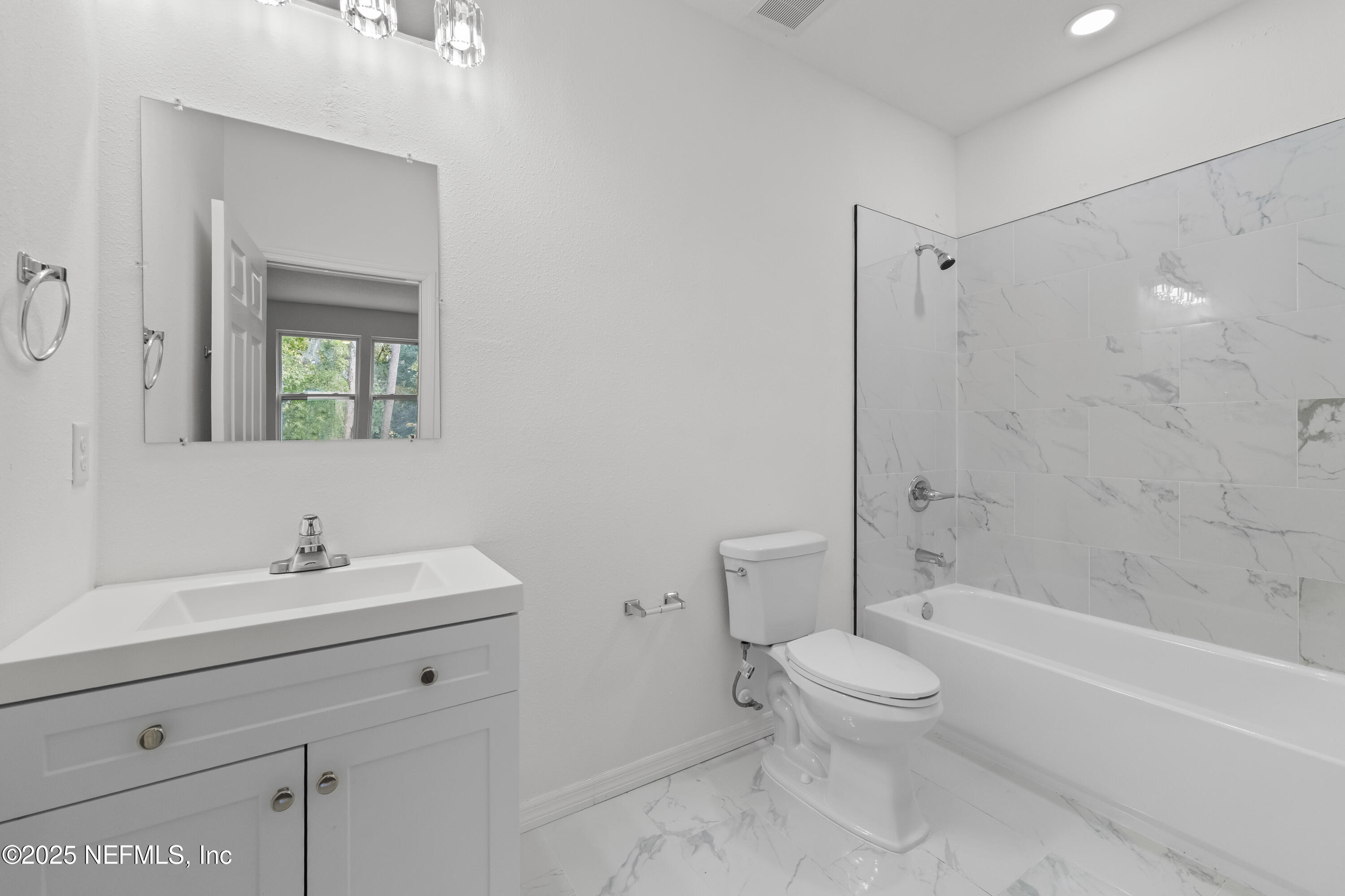 12476 Gate Road Jacksonville, FL 32226 - Photo 17 of 29 a bathroom with a sink a toilet and shower